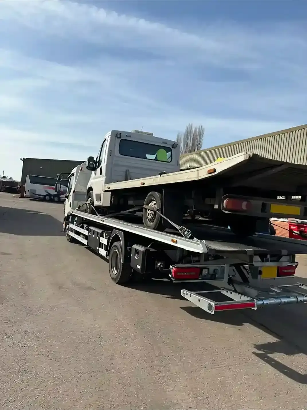 Professional flatbed truck and trailer recovery service. Premier Recoveries specialises in heavy vehicle transport and towing services across the UK with modern recovery equipment.