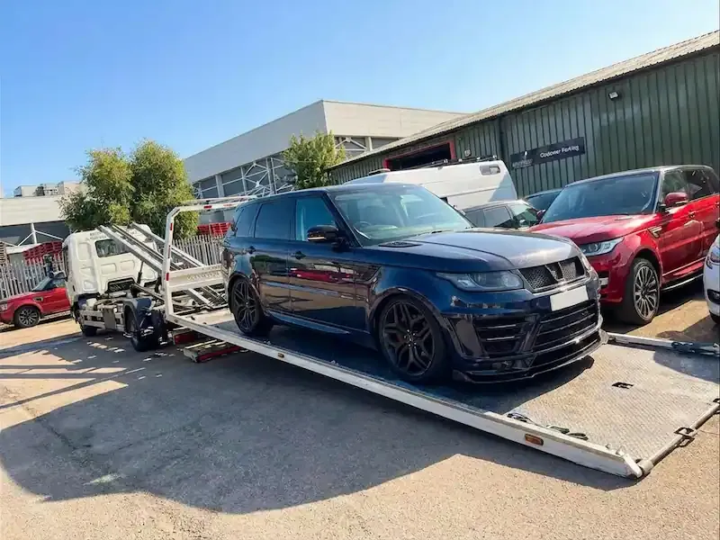 Modified Range Rover Sport low loader vehicle transport