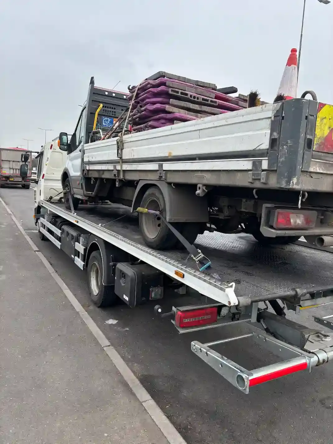 Ford Transit tipper truck breakdown recovery on flatbed vehicle. Premier Recoveries offers professional tipper and commercial vehicle recovery services with 24/7 availability across the UK.