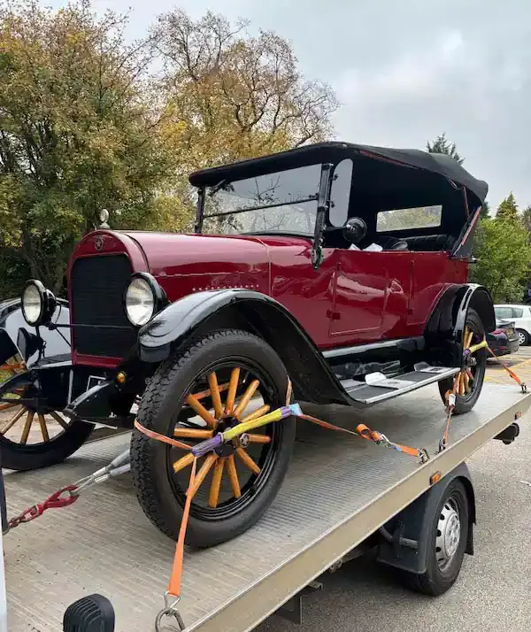 Vintage classic car transport service on flatbed